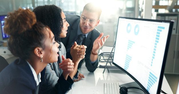 ERP Training & Change Management 4 Team analyzing ERP implementation dashboard for business analytics, sales performance, and financial data.